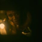 Deborah Ayorinde as Dawn holding a flashlight in THEM: The Scare